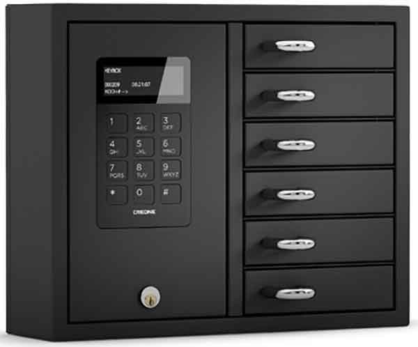 Woman selects a key from a Key Box System
