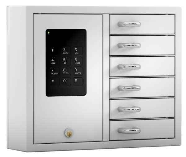 Woman selects a key from a Key Box System