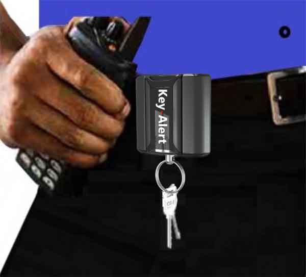 Woman selects a key from a Key Box System