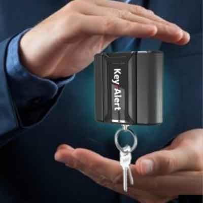 Woman selects a key from a Key Box System