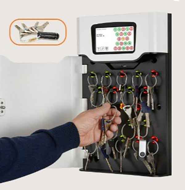 Woman selects a key from a Key Box System